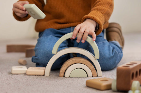 boy playing with math toys indoors