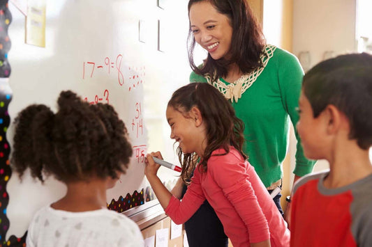 a teacher and group of kids answering math brain teasers